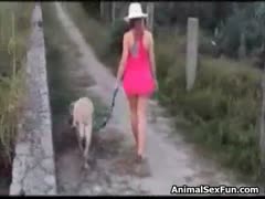 The lustful dog screws her pussy outside after the lewd slut whacks off her dog's dick.